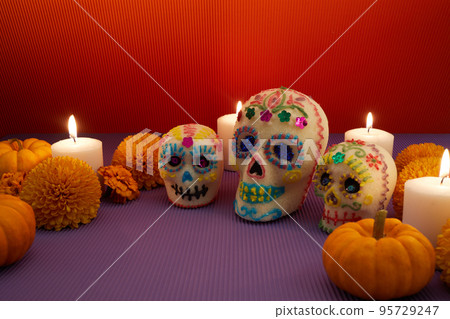 Dia de los muertos - Day of the dead Sugar skull with candles, and cempasuchil flowers altar decoration. 95729247