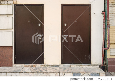 Two metal doors on facade Two metal doors on facade 95729404