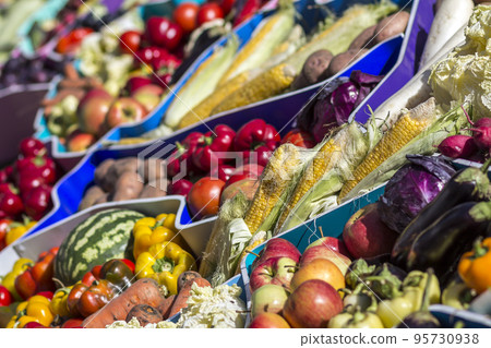 Farmers fruit market with various colorful fresh fruits and vegetables 95730938