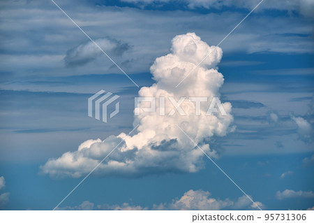 Bright landscape of white puffy cumulus clouds on blue clear sky. Bright landscape of white puffy cumulus clouds on blue clear sky. 95731306