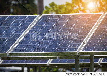 Solar panels installed on stand frame near parking lot for effective generation of clean electricity. Photovoltaic technology integrated in urban infrastructure for electric car charging Solar panels installed on stand frame near parking lot for effective generation of clean electricity. Photovoltaic technology integrated in urban infrastructure for electric car charging 95731501