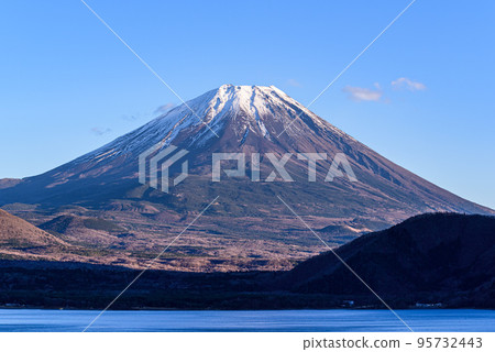 Snow-covered Mt.Fuji and a clear sky, superb view from Lake Motosuko Snow-covered Mt.Fuji and a clear sky, superb view from Lake Motosuko 95732443