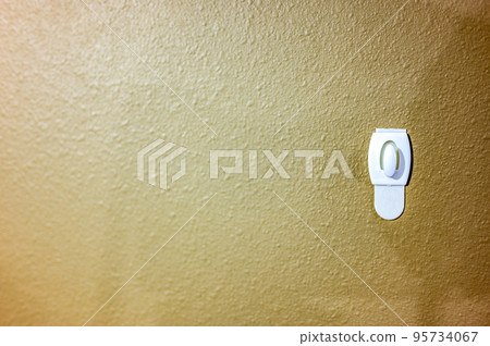 Selective focus on adhesive strip wall hanger that can be removed by pulling tape Selective focus on adhesive strip wall hanger that can be removed by pulling tape 95734067