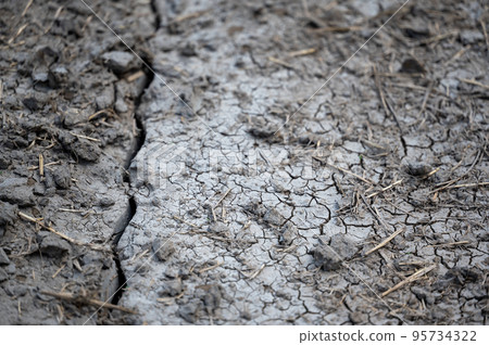 Trench in soil from knife injecting manure fertilizer in the fall. Trench in soil from knife injecting manure fertilizer in the fall. 95734322