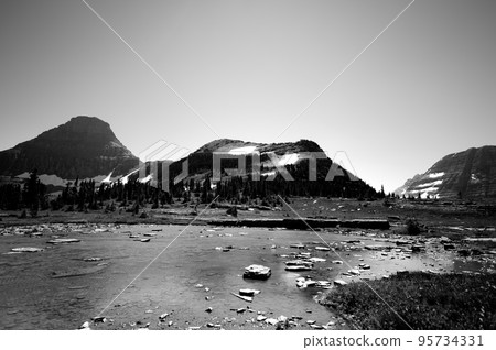 Snow-melt runoff along Logan Pass trail to Hidden Lake at Glacier National Park, Montana.  95734331
