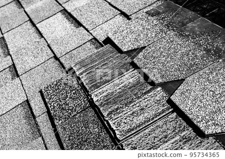 Assorted selection of premium synthetic roof shingles to pick a new style. 95734365