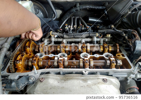 Close up of parts in engine head for adjust valve engine Close up of parts in engine head for adjust valve engine 95736516