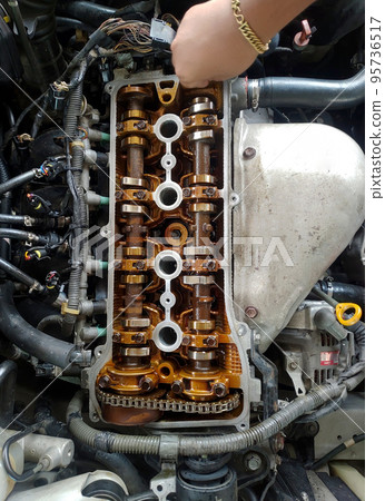 Close up of parts in engine head for adjust valve engine Close up of parts in engine head for adjust valve engine 95736517