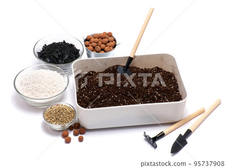 plastic box with substrate soil for transplanting houseplants isolated on white background plastic box with substrate soil for transplanting houseplants isolated on white background 95737908