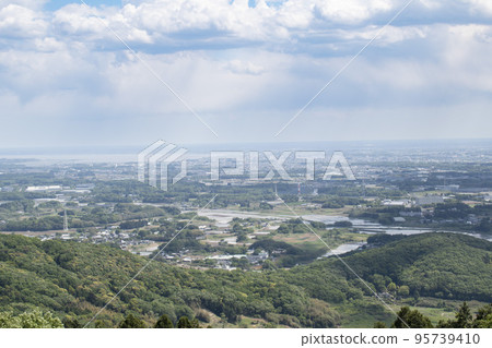Distant landscape taken from a hill overlooking the townscape Distant landscape taken from a hill overlooking the townscape 95739410