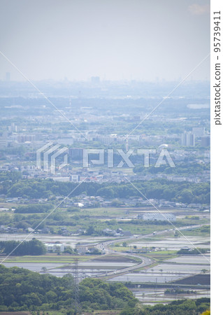 Distant landscape taken from a hill overlooking the townscape Distant landscape taken from a hill overlooking the townscape 95739411
