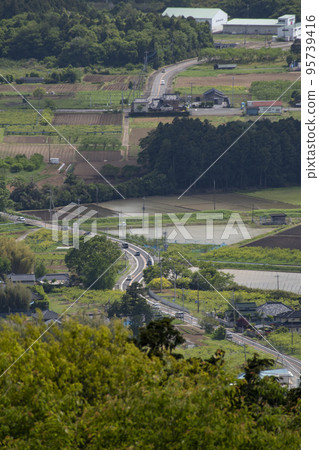 Distant landscape taken from a hill overlooking the townscape Distant landscape taken from a hill overlooking the townscape 95739416