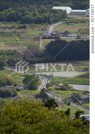Distant landscape taken from a hill overlooking the townscape Distant landscape taken from a hill overlooking the townscape 95739417