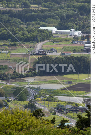Distant landscape taken from a hill overlooking the townscape Distant landscape taken from a hill overlooking the townscape 95739418
