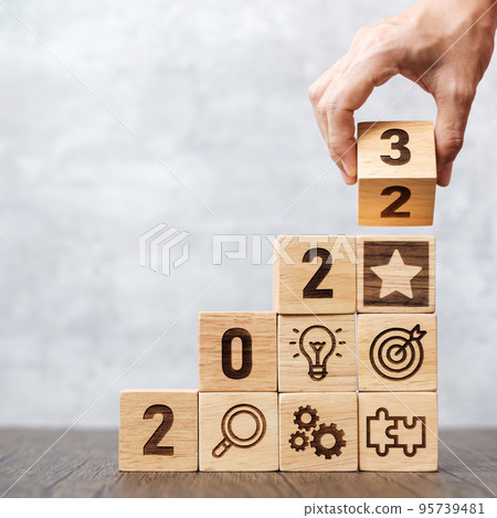 2023 wood block with business success, goal, strategy, target, mission, action, objective, teamwork, plan, idea and New Year start concept 95739481
