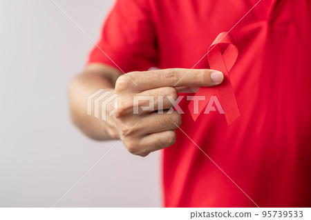 Red Ribbon for December World Aids Day, acquired immune deficiency syndrome, multiple myeloma Cancer Awareness month and National Red ribbon week. Healthcare and world cancer day concept 95739533