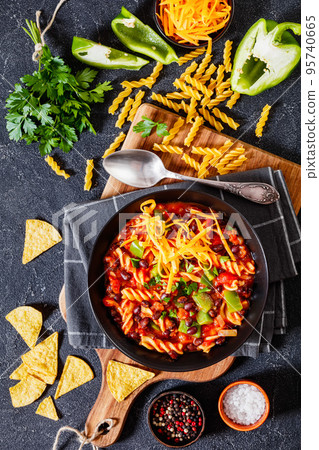 Black Bean Soup with spiral pasta and vegetables 95740665
