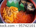 Sea urchin and salmon roe seafood bowl - stock photo 95742101