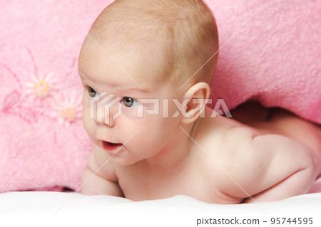 Baby girl After Bath Wrapped in Red Towel Laying and Posing Baby girl After Bath Wrapped in Red Towel Laying and Posing 95744595