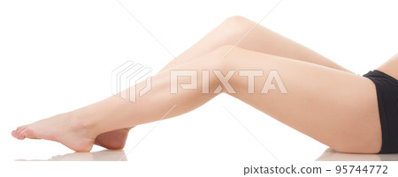 Beautiful slender female legs with flower Beautiful slender female legs with flower 95744772