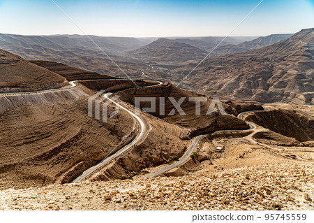 Road descending into Wadi Mujib Canyon in Jordan 95745559