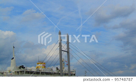 X cloud and big suspension bridge ferry 95748787