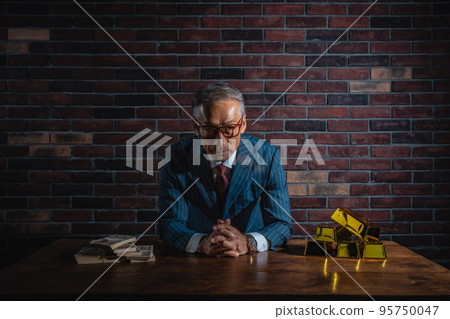 Senior man in suit with financial products Senior man in suit with financial products 95750047