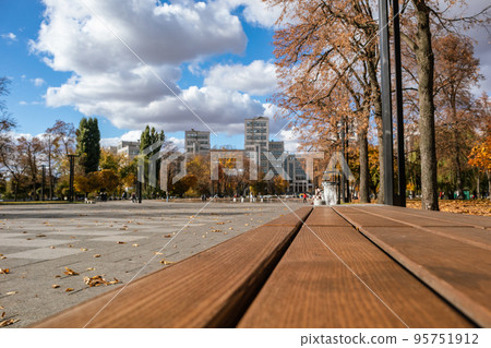 Bench in autumn recreation area in Kharkiv Ukraine Bench in autumn recreation area in Kharkiv Ukraine 95751912