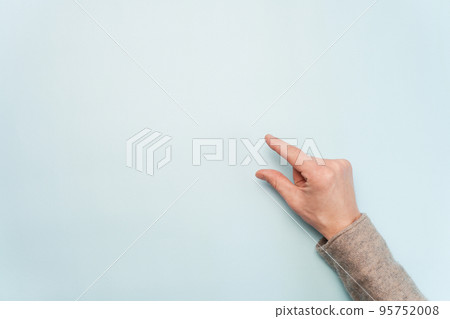 person pasting a greeting on the wall. person pasting a greeting on the wall. 95752008