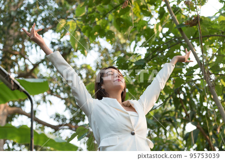 Happy woman raised arms enjoying the beautiful morning outdoors, I can do it, keep fighting, everything can be success, healthy life balance. 95753039