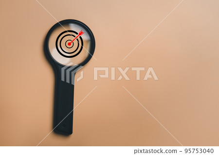 Board with magnifier glass for focus business objective, isolated background and copy space. Search, goal, target, strategy concept. 95753040