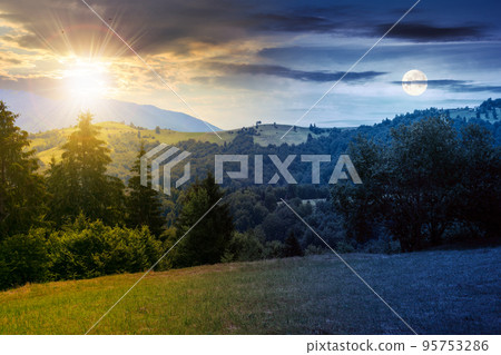 coniferous forest on the hill at daybreak. day and night time change concept. green summer nature scenery in carpathian mountains with sun and moon. sunny weather with clouds above the distant ridge 95753286