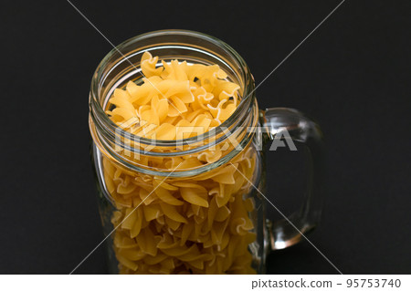 Uncooked Fusilli Pasta in Glass Jar Uncooked Fusilli Pasta in Glass Jar 95753740