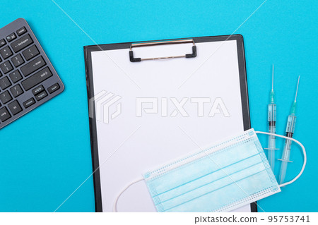 Vaccination or Revaccination Concept - Two Medical Syringe on Blue Table 95753741