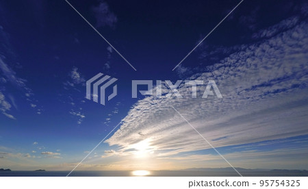 Refreshing autumn coastal evening view with belt-shaped clouds, super wide angle, mainly sky, 221011pm Refreshing autumn coastal evening view with belt-shaped clouds, super wide angle, mainly sky, 221011pm 95754325