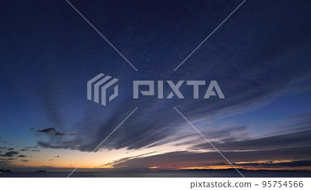 Colorful twilight coastal evening scene with afterglow of belt-shaped clouds・Autumn・Super wide angle・Sky mainly・221011pm 95754566