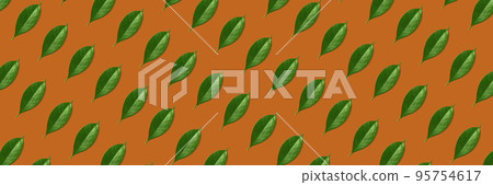 Creative seamless pattern of green leaves on orange background. Creative design in flat lay style. Top view. Mock-up. Creative seamless pattern of green leaves on orange background. Creative design in flat lay style. Top view. Mock-up. 95754617