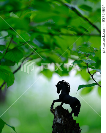 Green and horse figure Green and horse figure 95754694