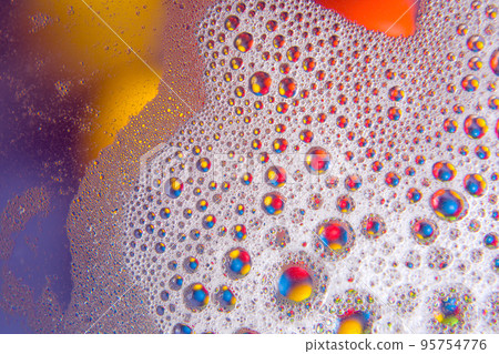 abstract colored balls of oily liquid on a blurred background abstract colored balls of oily liquid on a blurred background 95754776
