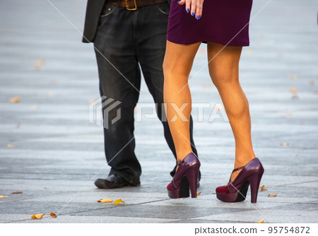 Feet of dancing couples on the street Feet of dancing couples on the street 95754872