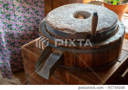 Old Millstones for the mill, close-up photo. Old Millstones for the mill, close-up photo. 95756086