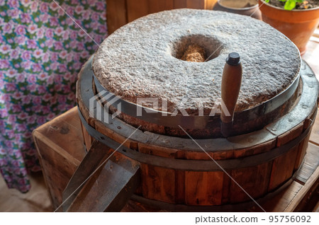 Old Millstones for the mill, close-up photo. Old Millstones for the mill, close-up photo. 95756092