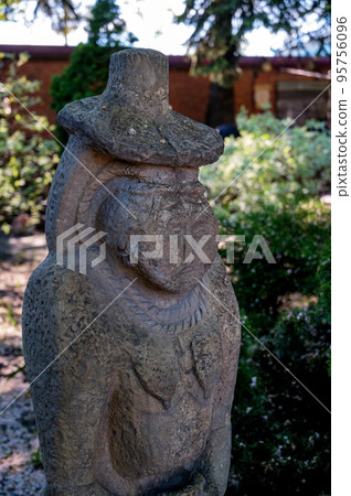 Idol statue. Statue on the background of nature. Idol statue. Statue on the background of nature. 95756096