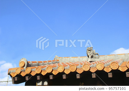 Red roof tiles of houses in Okinawa 95757101