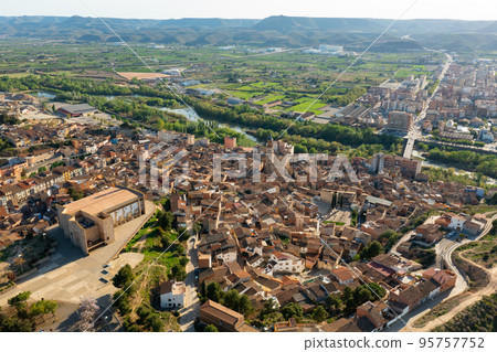 Aerial view of Fraga cityscape on banks of Cinca river 95757752
