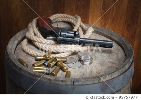 Old west revolver with cartridges 95757977