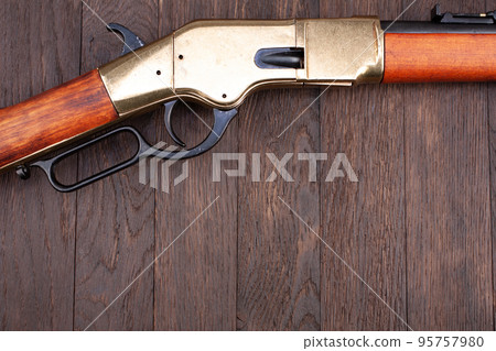 Old west gun. Lever-action repeating rifle. 95757980