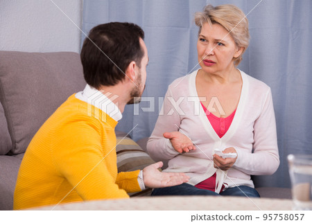 Mother and son arguing Mother and son arguing 95758057