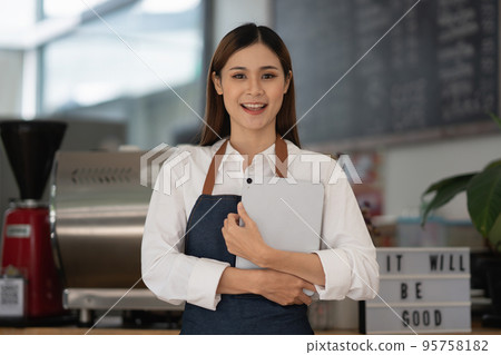 Successful small business owner sme beauty girl stand at her cafe Successful small business owner sme beauty girl stand at her cafe 95758182