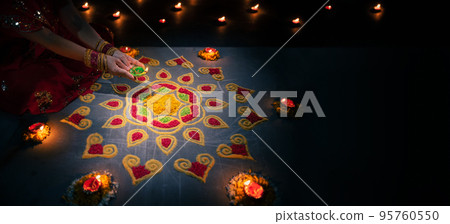 Traditional diya lamps lit during diwali celebration 95760550